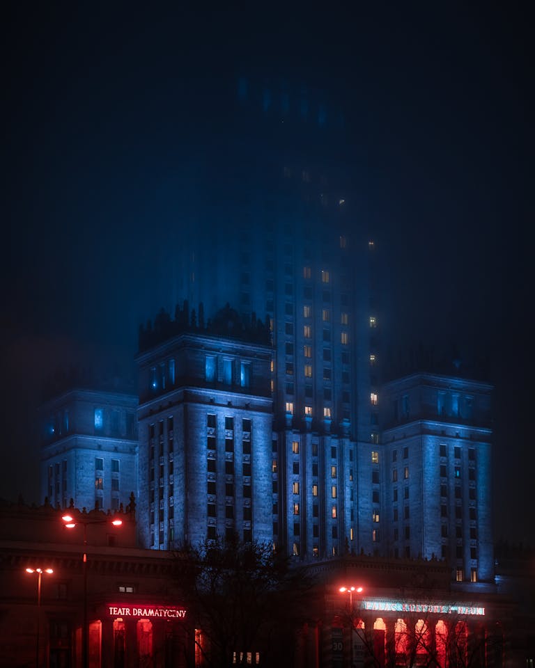 High-Rise Concrete Building Covered with Fog during Nighttime